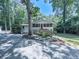 Exterior of home featuring a screened porch, stairs, and an American flag at 543 S Holly Springs Rd, Woodstock, GA 30188