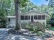Charming home featuring a screened-in porch and mature trees at 543 S Holly Springs Rd, Woodstock, GA 30188