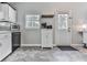The kitchen has vinyl floors and direct access to the backyard at 543 S Holly Springs Rd, Woodstock, GA 30188