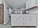 Kitchen with overhead cabinets and an island with dining space at 543 S Holly Springs Rd, Woodstock, GA 30188