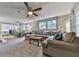 Open living room is cozy and features natural light at 543 S Holly Springs Rd, Woodstock, GA 30188