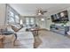 Comfortable living room featuring a TV, couch, and lots of natural light at 543 S Holly Springs Rd, Woodstock, GA 30188