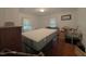 Bright bedroom features hardwood floors, natural light, and a comfortable space for relaxation at 6385 Highway 92, Fairburn, GA 30213