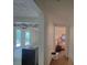 Hallway featuring a wooden floor, neutral paint, and an archway that leads to another room at 6385 Highway 92, Fairburn, GA 30213
