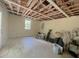 Bare living room featuring exposed beams on the ceiling, neutral colored walls, and one window at 6385 Highway 92, Fairburn, GA 30213