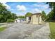 A one-story home with a detached garage and a cracked driveway at 954 Bryant Sw St, Conyers, GA 30012