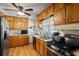 Functional kitchen featuring wood cabinets, ample counter space, and stainless steel appliances at 954 Bryant Sw St, Conyers, GA 30012