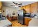 Spacious kitchen with stainless steel appliances and adjacent dining area with lots of light at 954 Bryant Sw St, Conyers, GA 30012