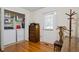 Functional laundry room with washer, dryer, and storage shelving at 954 Bryant Sw St, Conyers, GA 30012
