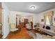 Sunlit living room with hardwood floors, a decorative rug, and a view into the dining area at 954 Bryant Sw St, Conyers, GA 30012