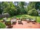 Beautiful backyard patio featuring ample seating and lush greenery, perfect for outdoor gatherings at 1359 Scott Blvd, Decatur, GA 30030