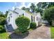 Quaint home exterior with black shutters, a well-maintained lawn, and a private driveway at 1359 Scott Blvd, Decatur, GA 30030