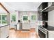 Well-lit kitchen featuring stainless steel appliances, white cabinets, and direct backyard access at 1359 Scott Blvd, Decatur, GA 30030