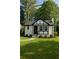 Charming home with manicured lawn, black trim, and inviting front entrance at 1658 Altadena Sw Pl, Atlanta, GA 30311