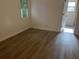 Bright bedroom with new floors, fresh paint and updated baseboards for a modern look at 185 Colemans Bluff Dr, Woodstock, GA 30188