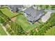 Aerial view of home with fenced backyard and patio in a well manicured neighborhood at 1865 Henley Way, Alpharetta, GA 30009