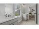 Bright bathroom with double vanities and a window, offering ample natural light at 1865 Henley Way, Alpharetta, GA 30009