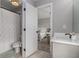Bathroom with shower, modern fixtures, and light-colored flooring at 1865 Henley Way, Alpharetta, GA 30009