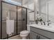 Modern bathroom featuring a glass-enclosed shower and sleek vanity at 1865 Henley Way, Alpharetta, GA 30009