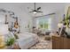 Well lit bedroom with instruments, a desk, and bright natural light at 1865 Henley Way, Alpharetta, GA 30009