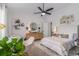 Stylishly decorated bedroom featuring a ceiling fan and neutral tones at 1865 Henley Way, Alpharetta, GA 30009