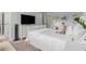 Spacious bedroom with attached work space, TV, and neutral carpet at 1865 Henley Way, Alpharetta, GA 30009
