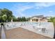 Relaxing community pool area with comfortable seating and lush landscaping at 1865 Henley Way, Alpharetta, GA 30009