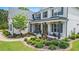Beautiful home exterior with a inviting covered front porch and well-maintained landscaping at 1865 Henley Way, Alpharetta, GA 30009