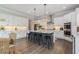Bright and modern kitchen with a large center island, pendant lighting, and stainless steel appliances at 1865 Henley Way, Alpharetta, GA 30009