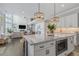 Kitchen view showcasing island and seamless integration with dining and living areas at 1865 Henley Way, Alpharetta, GA 30009