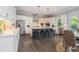 Modern kitchen with stainless steel appliances, center island with seating, and bright lighting at 1865 Henley Way, Alpharetta, GA 30009