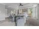 The airy main bedroom boasts a comfortable sitting area, large bed, and beautiful decor at 1865 Henley Way, Alpharetta, GA 30009