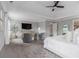 This spacious main bedroom with a sitting area provides a relaxing retreat at 1865 Henley Way, Alpharetta, GA 30009