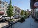 Picturesque view of sidewalk with Crave Pie shop front and buildings nearby at 1865 Henley Way, Alpharetta, GA 30009