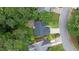 Aerial view of the property showcasing the home, lush backyard, patio, and surrounding greenery in a serene neighborhood at 5355 Wyntree Ct, Peachtree Corners, GA 30071