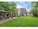 Lush backyard showcasing a well-manicured lawn, a charming gazebo, and a deck, offering outdoor enjoyment at 5355 Wyntree Ct, Peachtree Corners, GA 30071