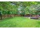Expansive backyard featuring a gazebo, playset, lush green lawn, perfect for outdoor activities at 5355 Wyntree Ct, Peachtree Corners, GA 30071