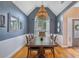 Elegant dining room with a vaulted ceiling, decorative lighting, and stylish wainscoting at 5355 Wyntree Ct, Peachtree Corners, GA 30071