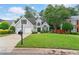 Charming two-story home with a well-manicured front lawn, inviting curb appeal and a two-car garage at 5355 Wyntree Ct, Peachtree Corners, GA 30071