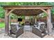 Outdoor gazebo with comfortable seating, fireplace, and TV, creating a relaxing entertainment space at 5355 Wyntree Ct, Peachtree Corners, GA 30071