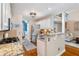 Contemporary kitchen featuring an open layout, a granite countertop bar, and stainless steel appliances at 5355 Wyntree Ct, Peachtree Corners, GA 30071