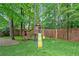 Backyard with a playground set featuring a slide, swing, and playhouse, ideal for outdoor fun at 5355 Wyntree Ct, Peachtree Corners, GA 30071