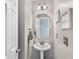 A charming powder room features a pedestal sink and stylish accents at 5355 Wyntree Ct, Peachtree Corners, GA 30071