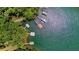 Aerial shot showcasing the waterfront property, docks, and lush surroundings at 7875 Robin Rd, Cumming, GA 30041