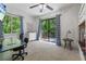 Bright bedroom with desk, large window and access to outdoor deck at 7875 Robin Rd, Cumming, GA 30041
