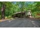 A cozy one story home featuring a well-maintained yard, mature trees and a ramp at 7875 Robin Rd, Cumming, GA 30041
