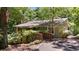 A cozy one story home featuring a well-maintained yard, mature trees and a ramp at 7875 Robin Rd, Cumming, GA 30041