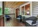 Charming front porch with wicker seating and lake-themed decor, perfect for relaxing at 7875 Robin Rd, Cumming, GA 30041