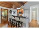 Kitchen area with breakfast bar and granite countertops at 7875 Robin Rd, Cumming, GA 30041
