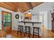 Kitchen with breakfast bar and wooden ceiling at 7875 Robin Rd, Cumming, GA 30041